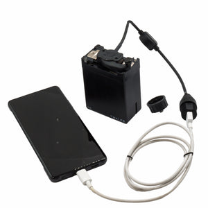 Silynx MBITR USB smartphone battery charger. Phone case with battery pack and cable on tactical gear