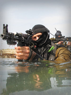 A Soldier with Silynx Eagle headset attached to a headband in water.