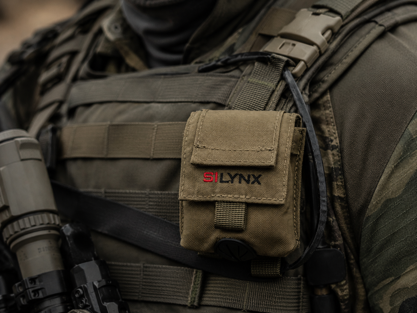 Molle headset pouch with Silynx' branding on a tactical vest