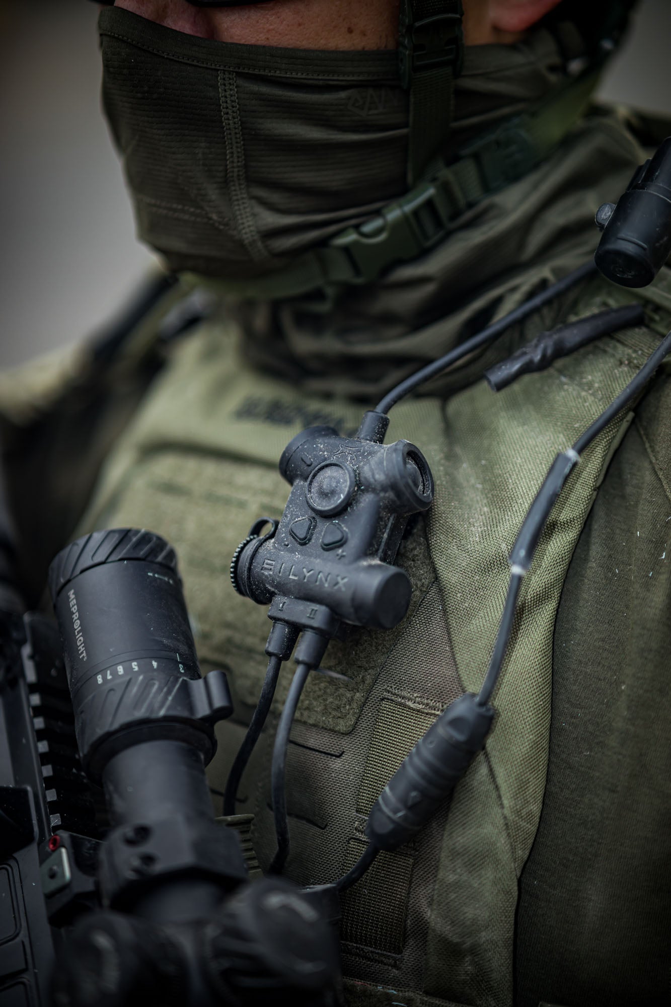 Close-up of a soldier wearing Silynx Clarus II  tactical gear with a weapon 