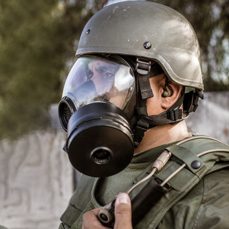 Police officer with Gas Mask and SIlynx Earpiece