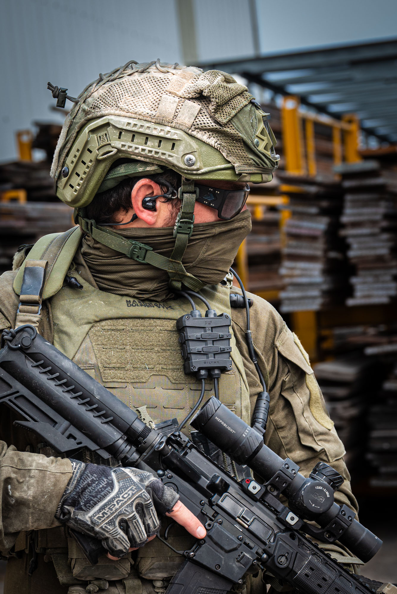 A Soldier with Fortis Control Box and Protego in-ear headset
